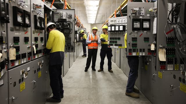 Engineer performing electrical testing with instruments