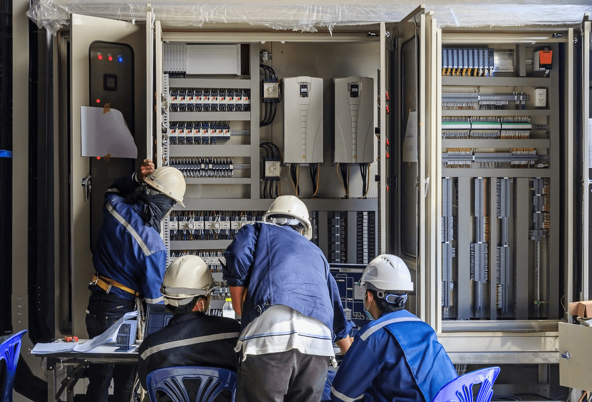 Maintenance team servicing electrical panels